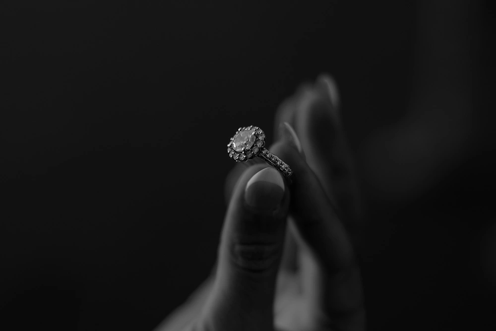 Close-up of diamond engagement ring, fine art wedding photography
